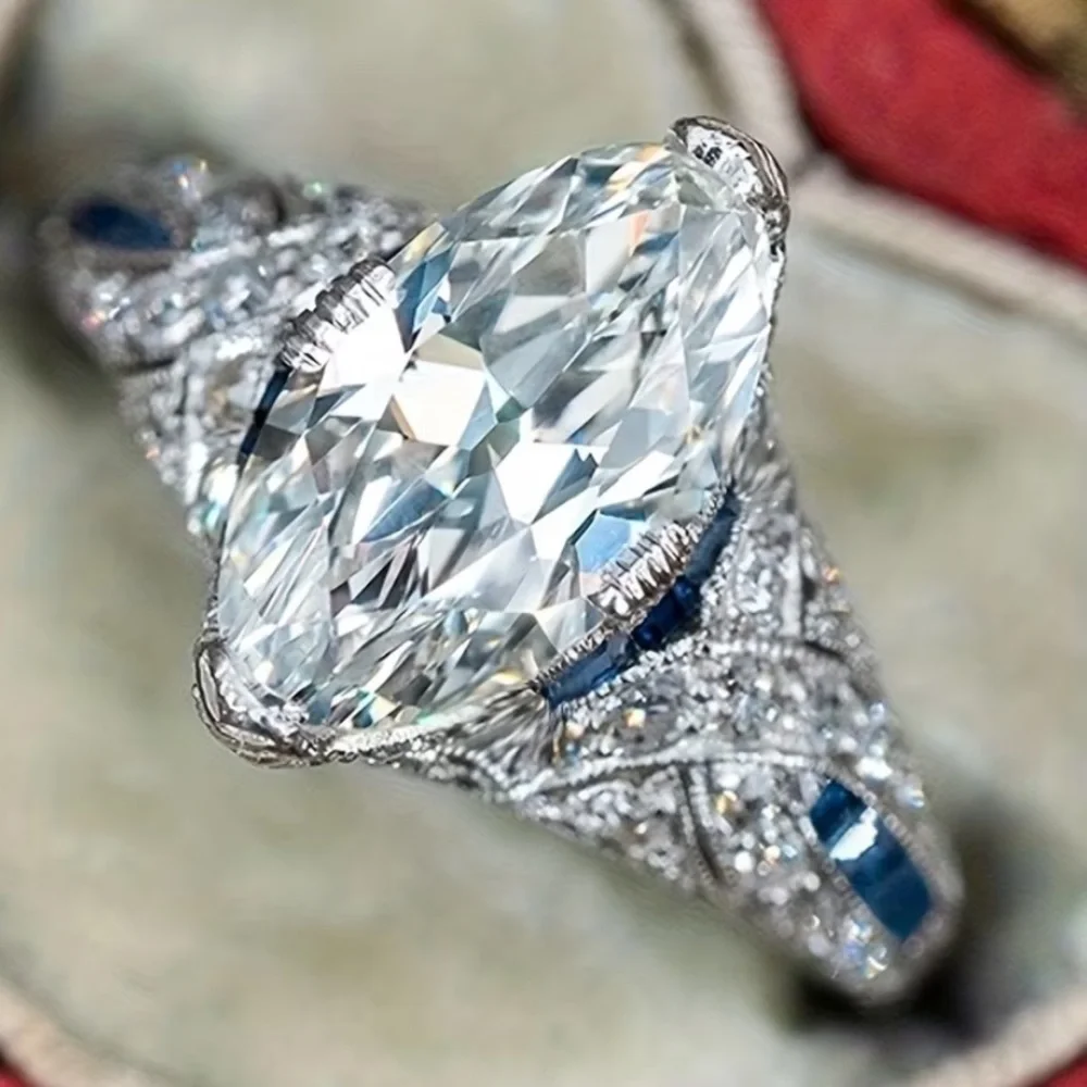 9.25 Sterling Silver Marquise Moissanite Ring with Blue Sapphire Accents - Picture 3 of 4